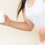 Woman Hand Holding Glass Of Milk Having Bad Stomach Ache Because