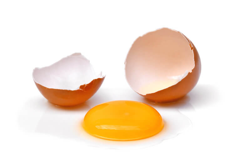 Cracked Egg With Egg Shell, Egg Yolk And Egg White