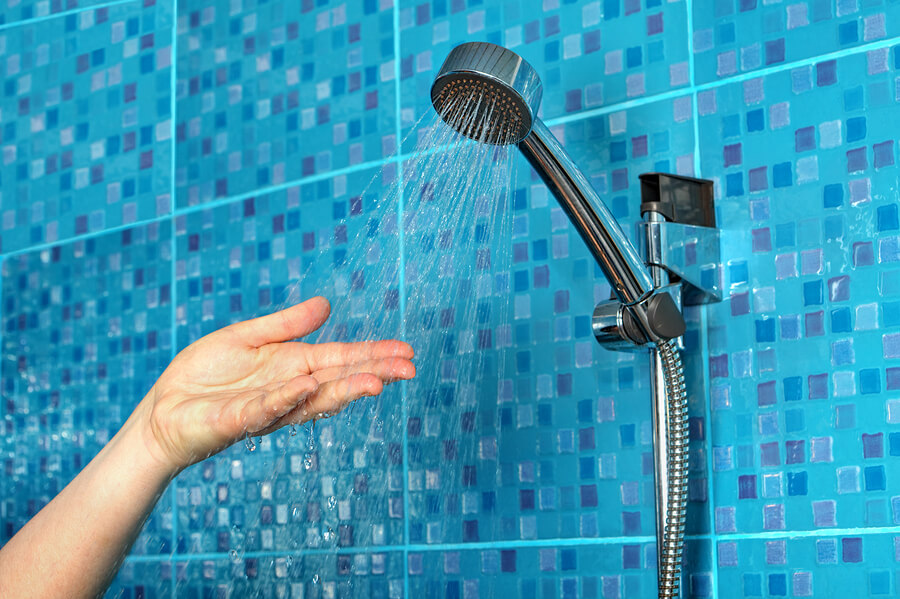 shower head spraying hand